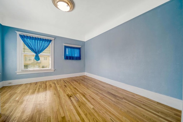 spare room with light wood-type flooring