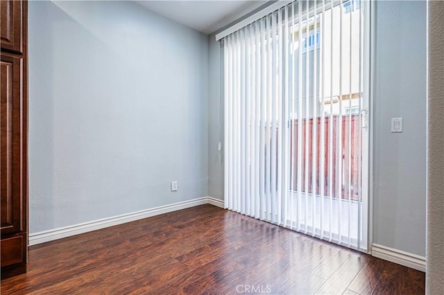 empty room with hardwood / wood-style floors