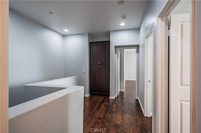 hallway featuring dark hardwood / wood-style flooring