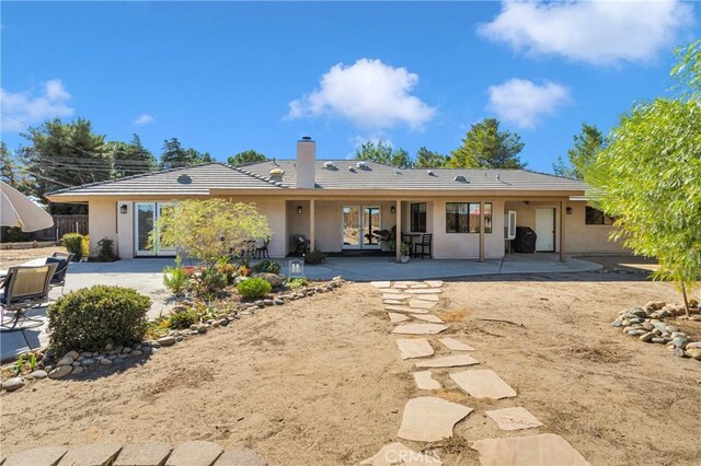 back of property featuring a patio area