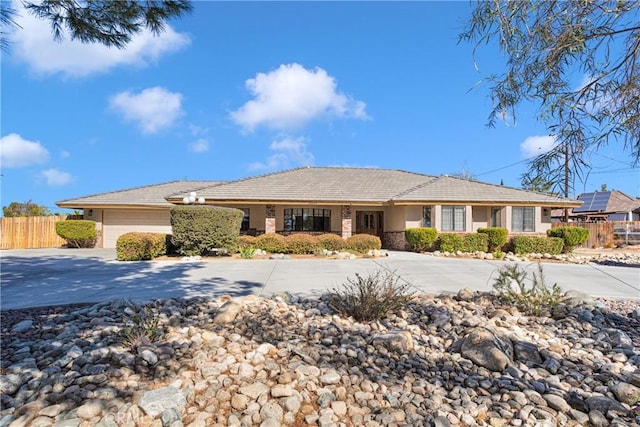 single story home featuring a garage