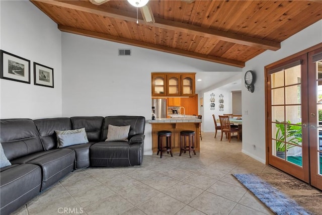 living room featuring french doors, wood ceiling, ceiling fan, vaulted ceiling with beams, and light tile patterned flooring