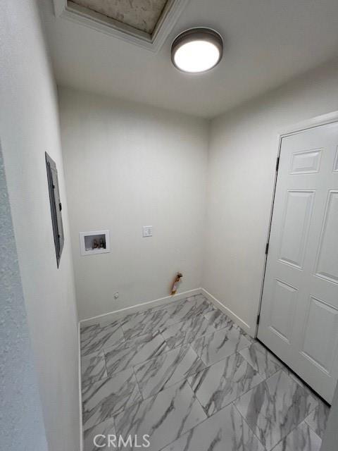 laundry room with washer hookup, gas dryer hookup, and ornamental molding