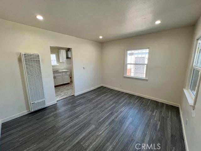 interior space with dark hardwood / wood-style flooring