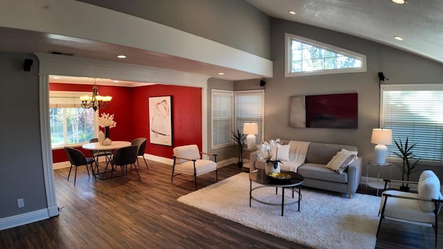 living room with dark wood-type flooring, lofted ceiling, and an inviting chandelier