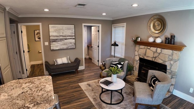 living room featuring dark hardwood / wood-style flooring, a fireplace, and ornamental molding