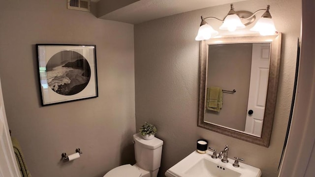 bathroom with sink and toilet