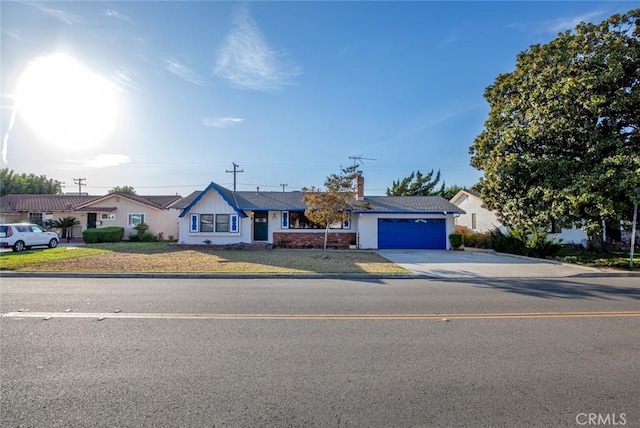 single story home featuring a garage