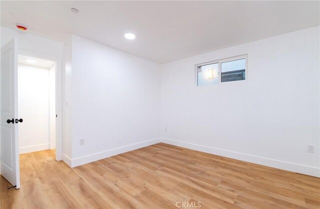 unfurnished room featuring light wood-type flooring