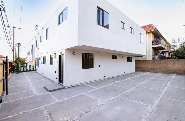 back of house with a patio