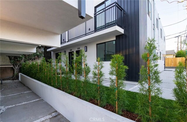 view of property exterior with a balcony