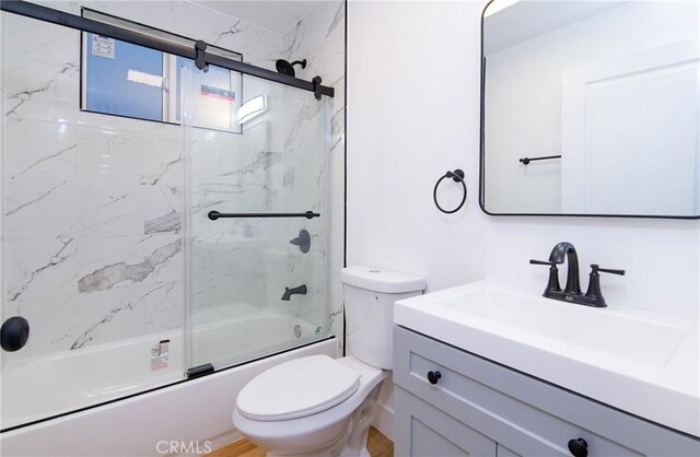 full bathroom with vanity, toilet, enclosed tub / shower combo, and wood-type flooring