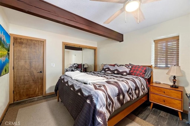 bedroom with beam ceiling and ceiling fan