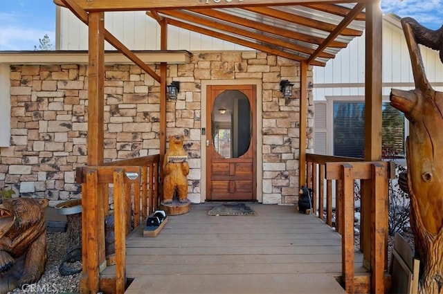 entrance to property with a deck