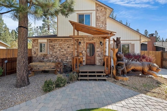 back of property with a wooden deck