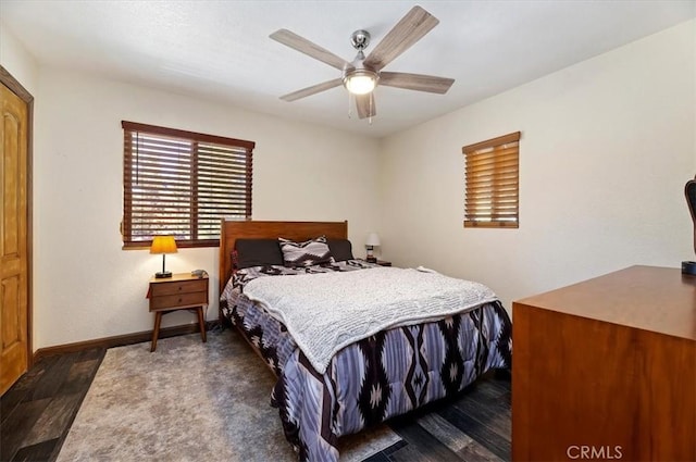 bedroom with ceiling fan and dark hardwood / wood-style flooring