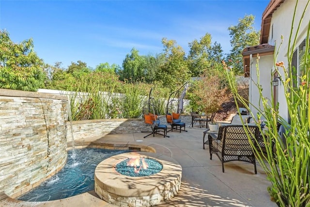 view of patio featuring an outdoor fire pit