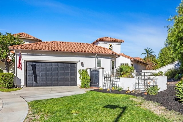 mediterranean / spanish house featuring a front lawn and a garage