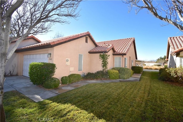 view of home's exterior featuring a garage and a lawn