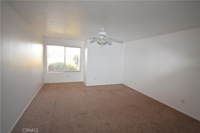 spare room with ceiling fan and carpet floors