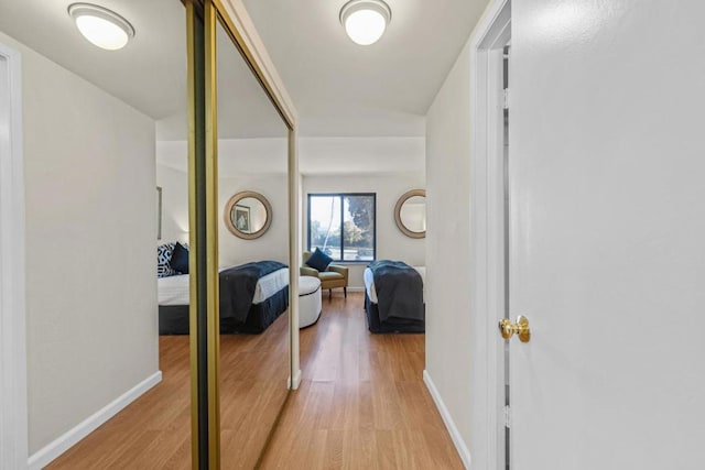 hall with light hardwood / wood-style floors