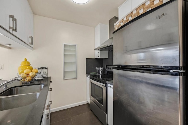 kitchen featuring white cabinetry, stainless steel appliances, and sink