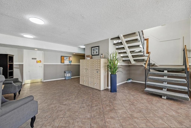 tiled living room featuring a textured ceiling