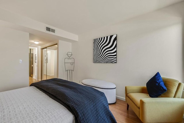 bedroom featuring a closet and light hardwood / wood-style floors