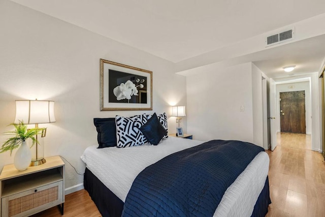 bedroom with light hardwood / wood-style floors