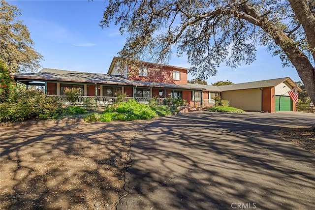 view of front of home with an outbuilding and a garage