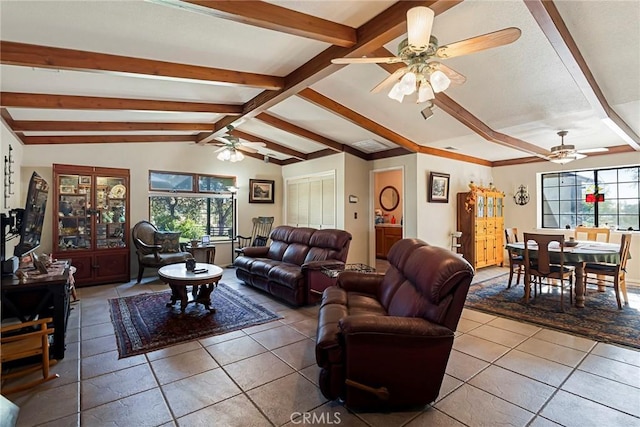 living room with tile patterned floors, vaulted ceiling with beams, and ceiling fan