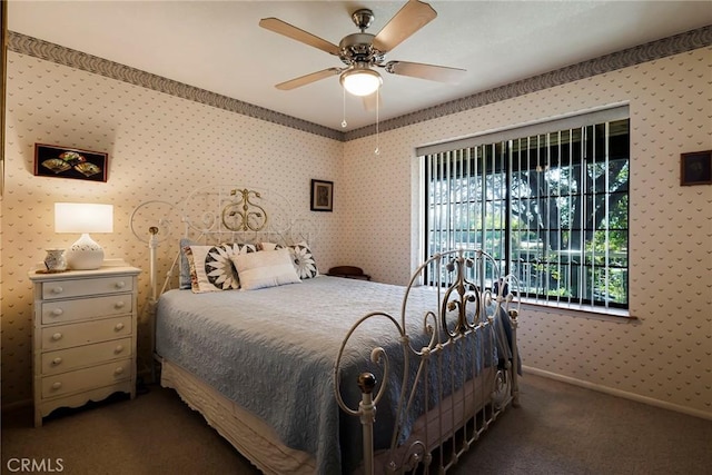 bedroom featuring ceiling fan and dark colored carpet