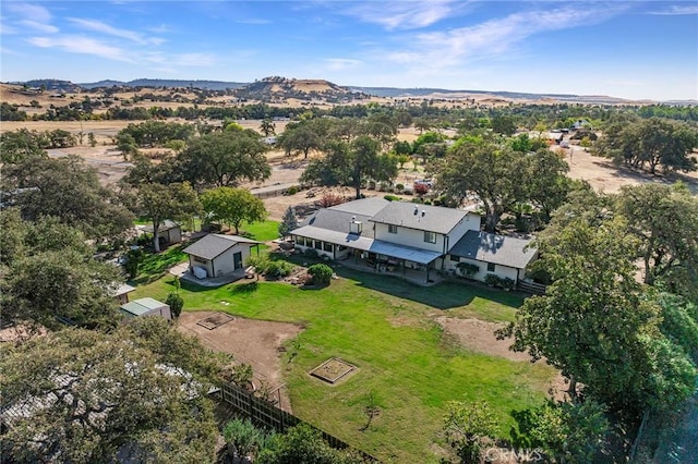 birds eye view of property featuring a mountain view