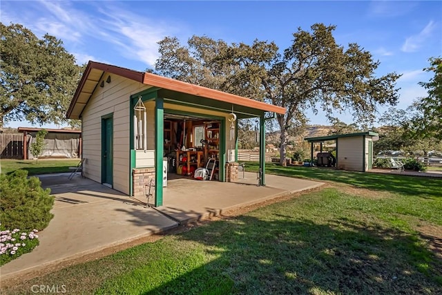 view of outbuilding featuring a yard