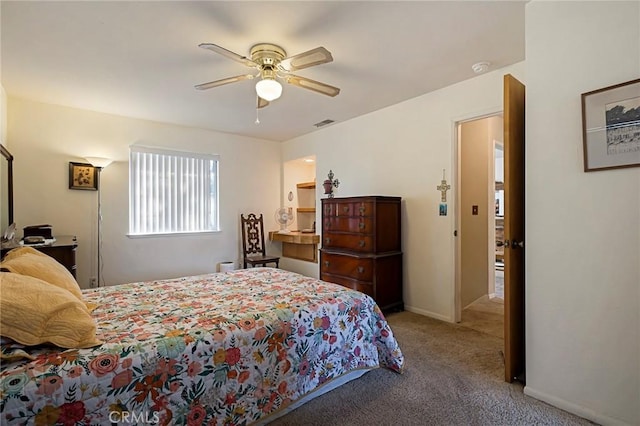 bedroom featuring ceiling fan and carpet