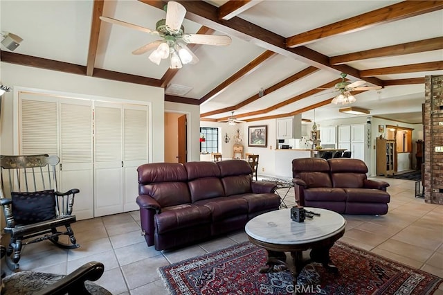 living room with light tile patterned floors and lofted ceiling with beams