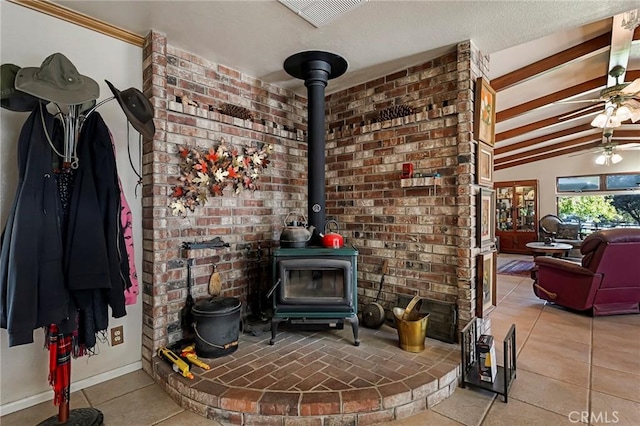 room details with ceiling fan and a wood stove