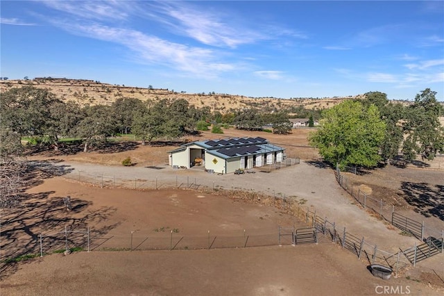 birds eye view of property featuring a rural view