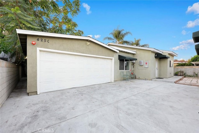 single story home with a garage