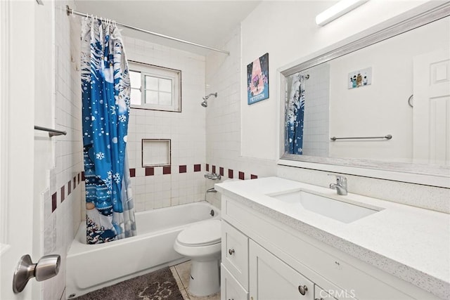 full bathroom with tile patterned floors, shower / tub combo with curtain, vanity, and toilet