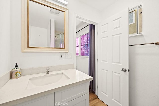 bathroom featuring vanity and wood-type flooring