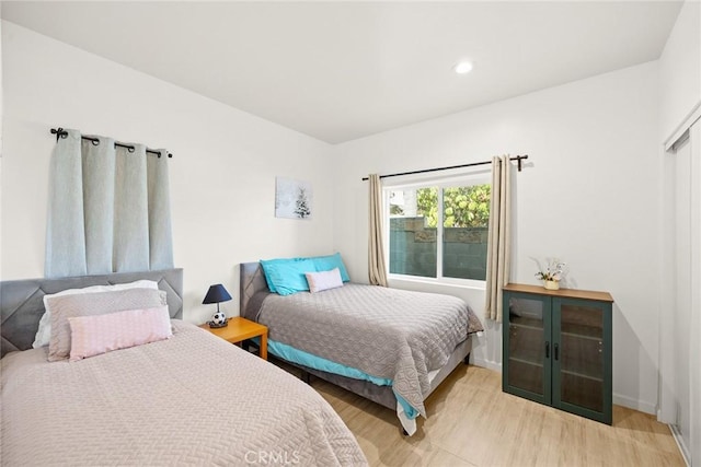 bedroom with light hardwood / wood-style flooring