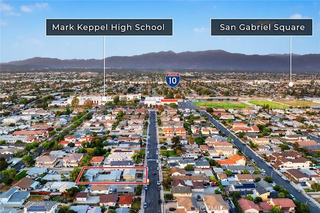 birds eye view of property with a mountain view