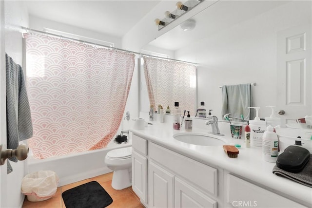 full bathroom with tile patterned floors, vanity, toilet, and shower / bathtub combination with curtain