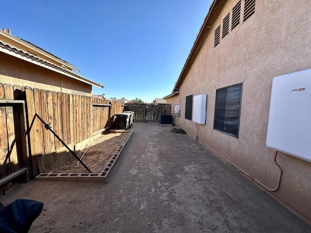 view of property exterior featuring central AC