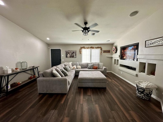 living room featuring ceiling fan, dark hardwood / wood-style flooring, and lofted ceiling