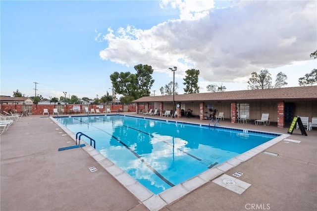 view of swimming pool with a patio area