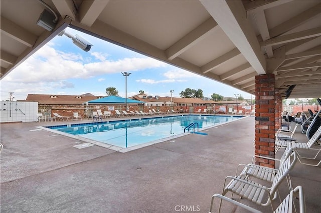 view of swimming pool featuring a patio