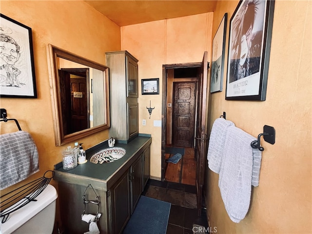 bathroom with tile patterned floors, sink, and toilet