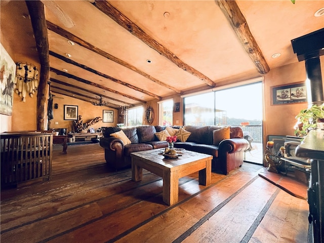 living area featuring hardwood / wood-style floors and vaulted ceiling with beams